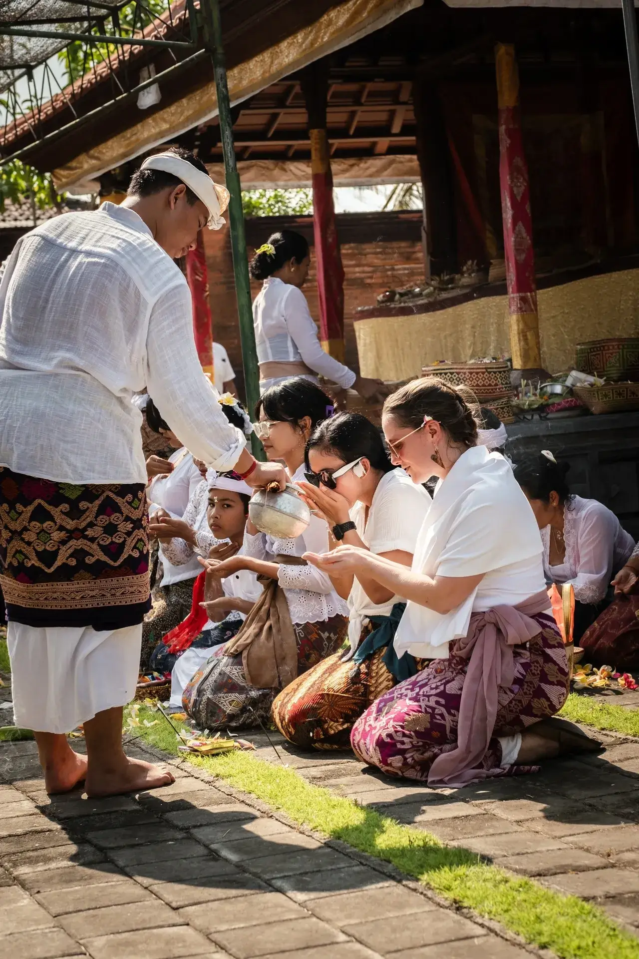 Traditional ceremony with people in cultural attire.