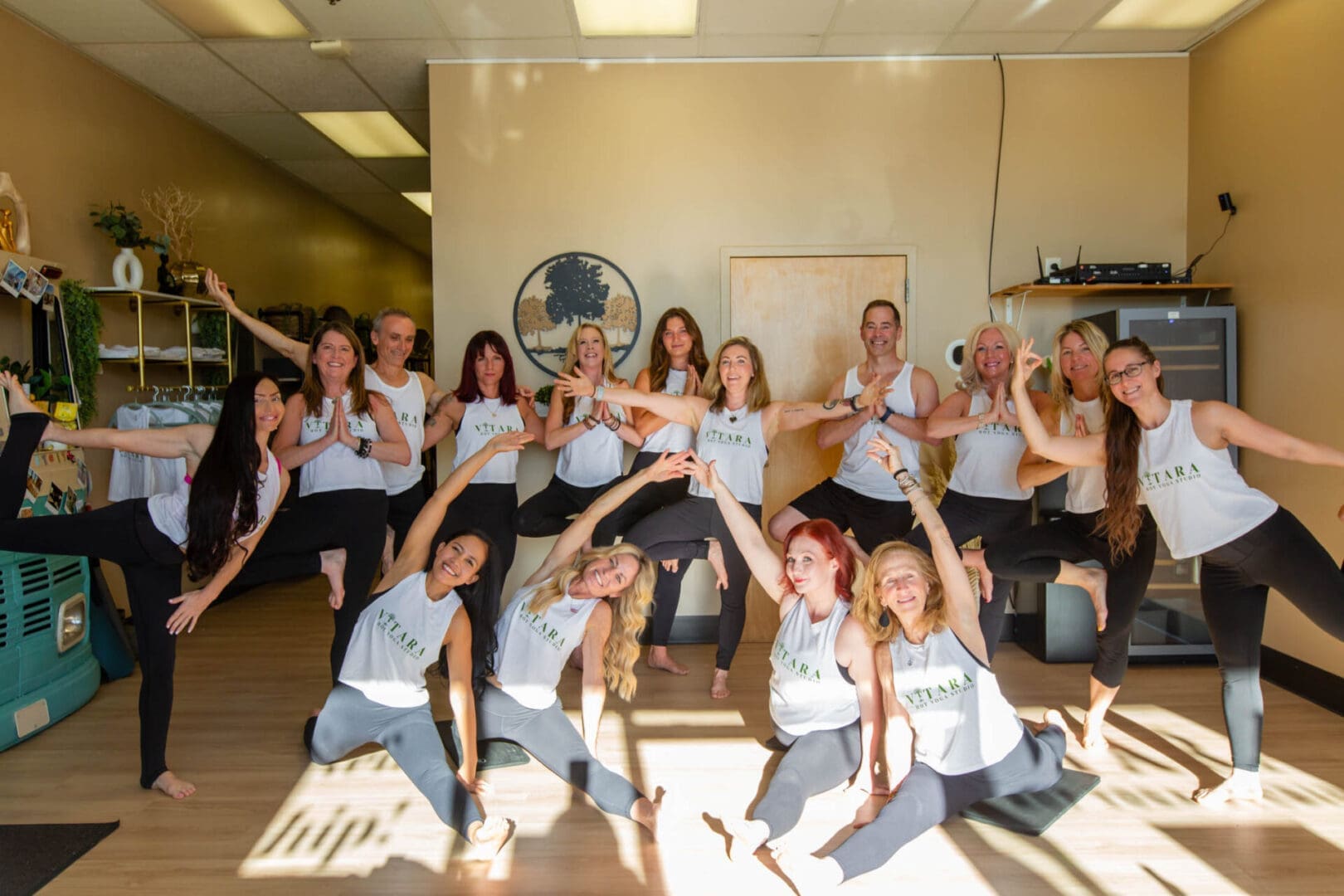 Group yoga class posing in studio