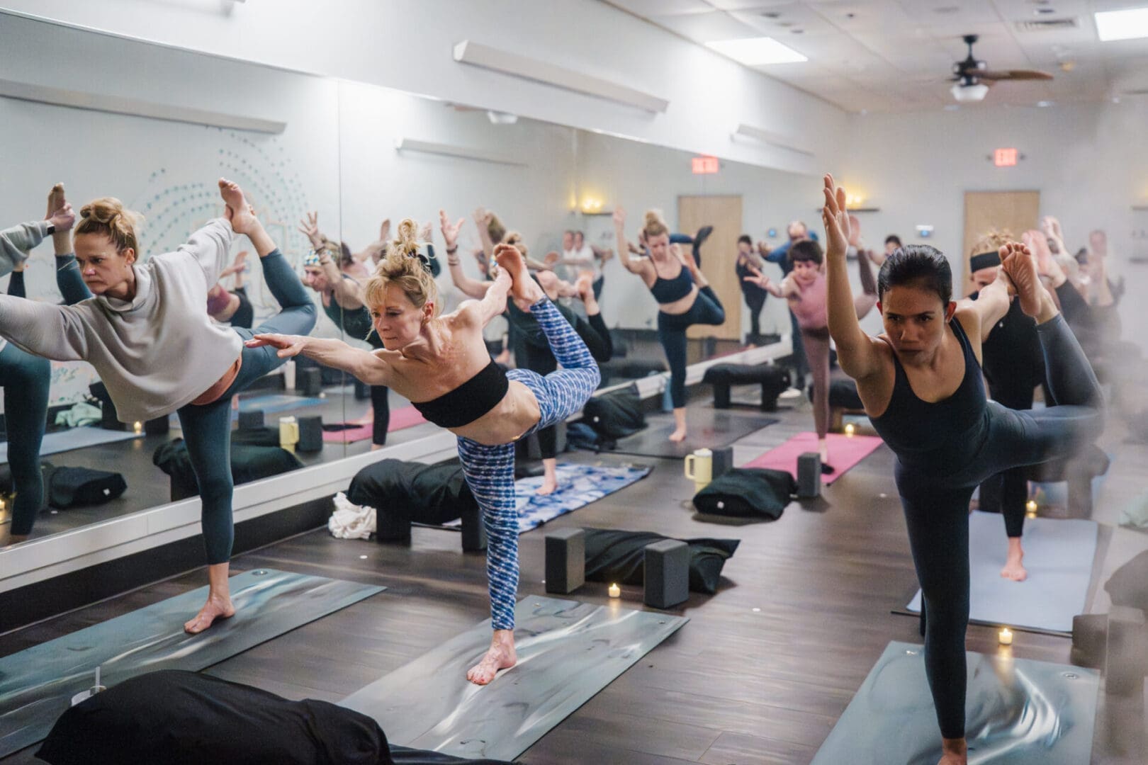 Group yoga class energy at Vitara Hot Yoga